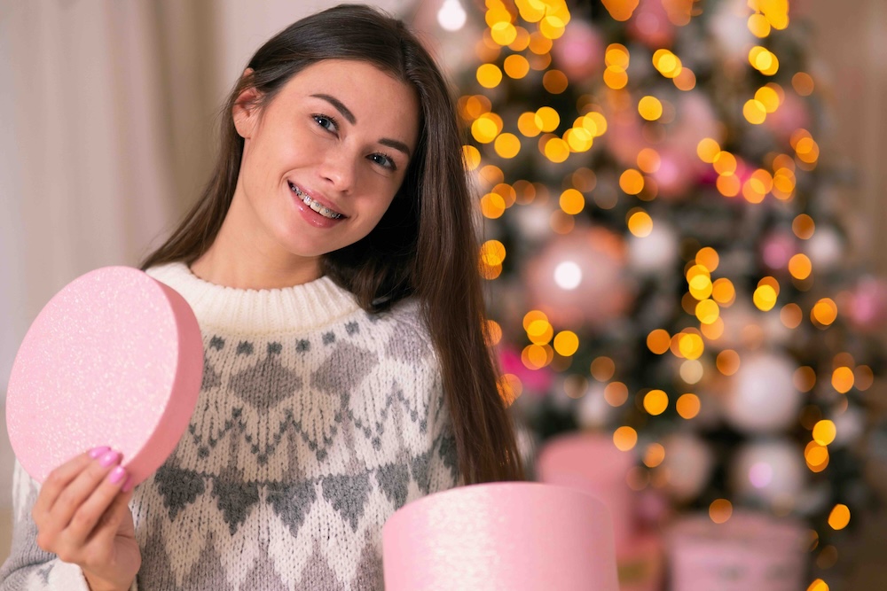 Teenager with braces smiling, showing off a confident smile and perfect orthodontic results.