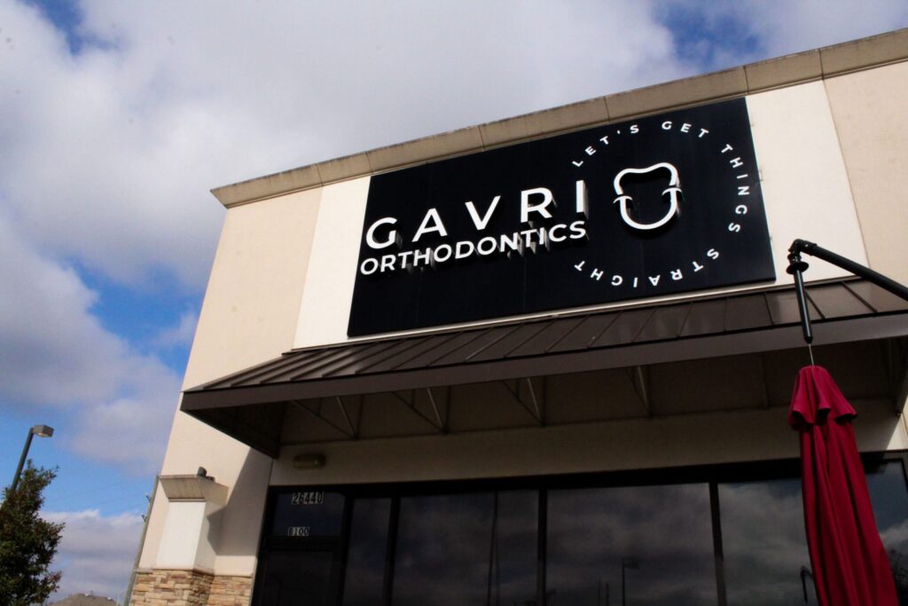 Exterior view of Gavri Orthodontics office with branded sign and entrance.